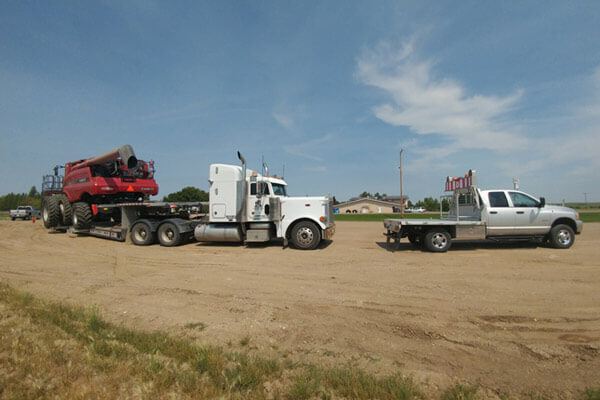 Red Combine Haul with Pilot Truck